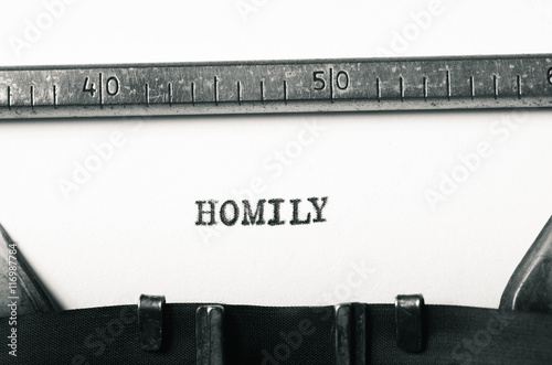 word homoly typed on typewriter