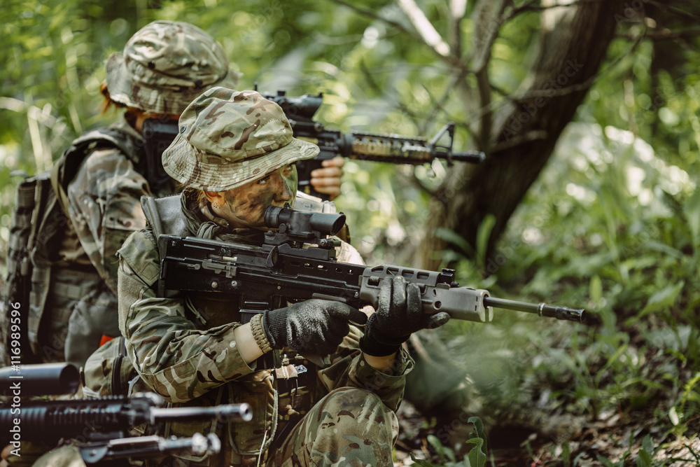 Special forces soldiers with weapon take part in military maneuv