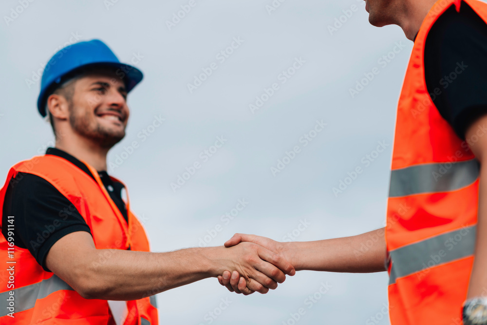 Handshake on construction site meeting Handshake on construction site meeting