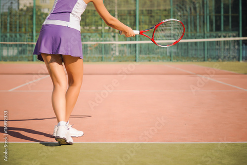 Young woman playing tennis.