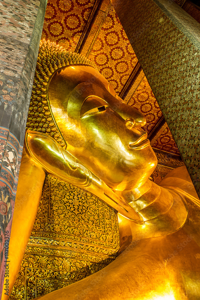 Reclining Buddha gold statue face in Wat Pho