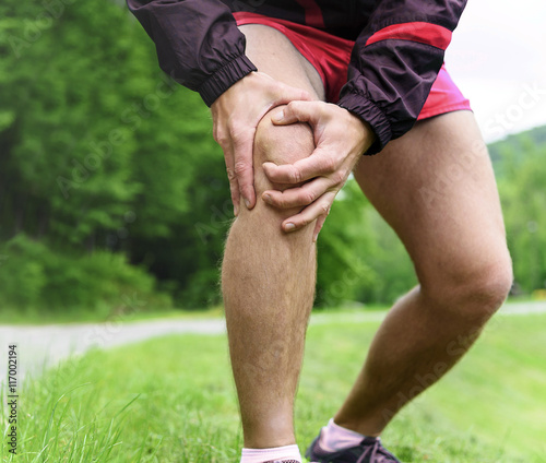Man out jogging with knee pain