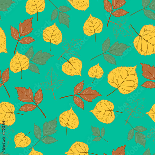 Autumn leaves on emerald green