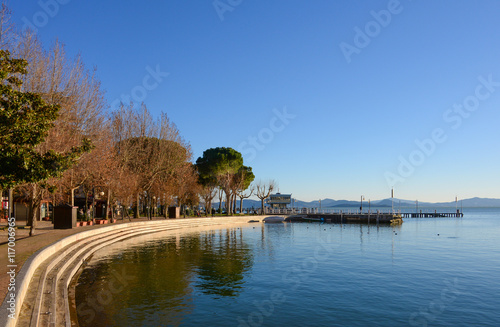 Trasimeno lake (Umbria, Italy) from the waterfront of the Passignano sul Trasimeno town.