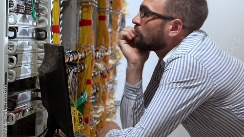 Engineer working in data room. Slow motion.