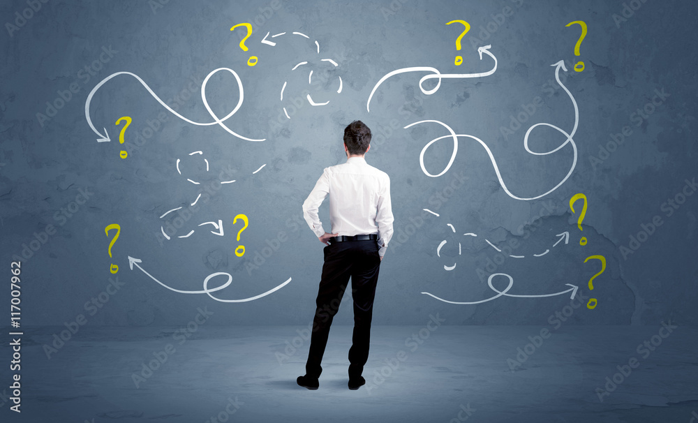Unsure businessman with question marks Stock-Foto | Adobe Stock