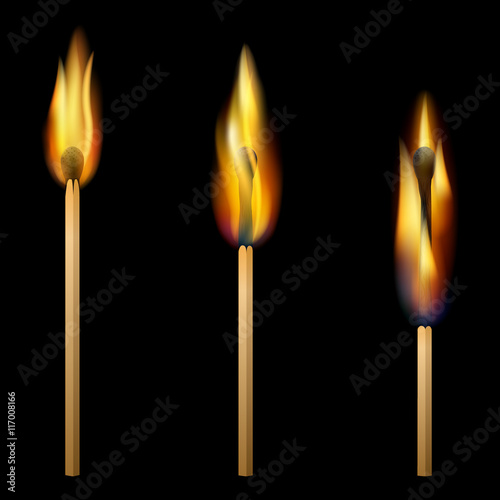 Burning matches on black background