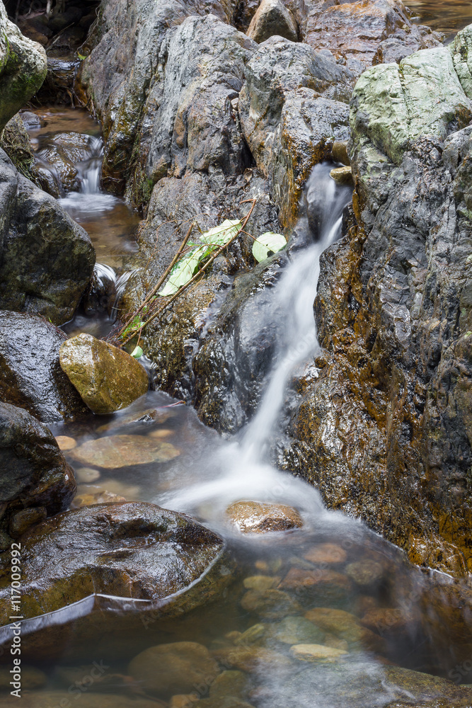 Rocks in stream with flowing water. Rocks in stream with flowing water.