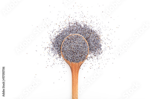 Black poppy seeds on a wooden spoon