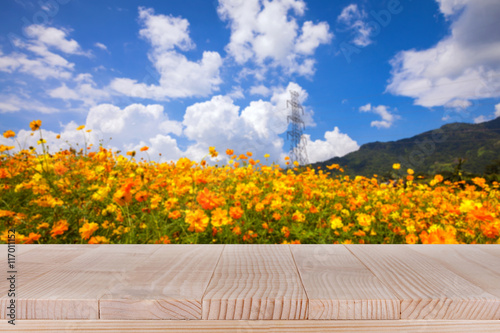 Wood table top on bokeh nature background - can be used for mont