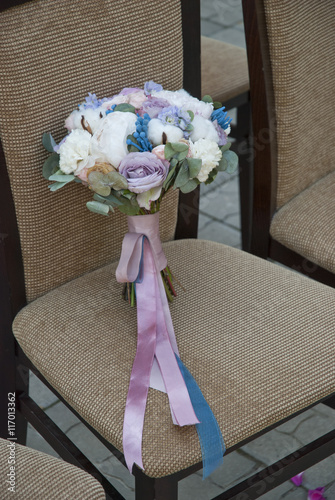 wedding brides bouquet on the chair 