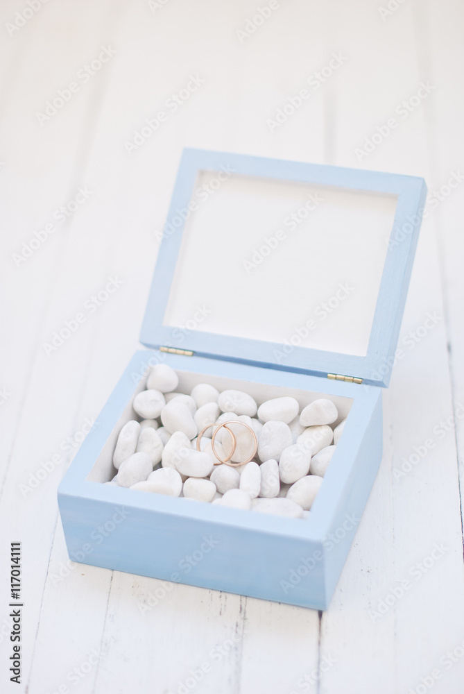 Wedding rings in blue box with white stone.Wedding ceremony Wedding rings in blue box with white stone.Wedding ceremony