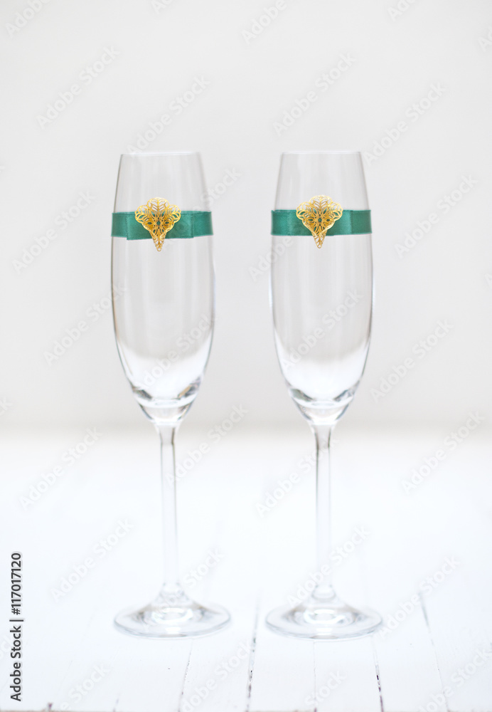 Two elegant champagne glasses with decoration ribbon.White background. Shallow depth of field Stock Photo | Adobe Stock