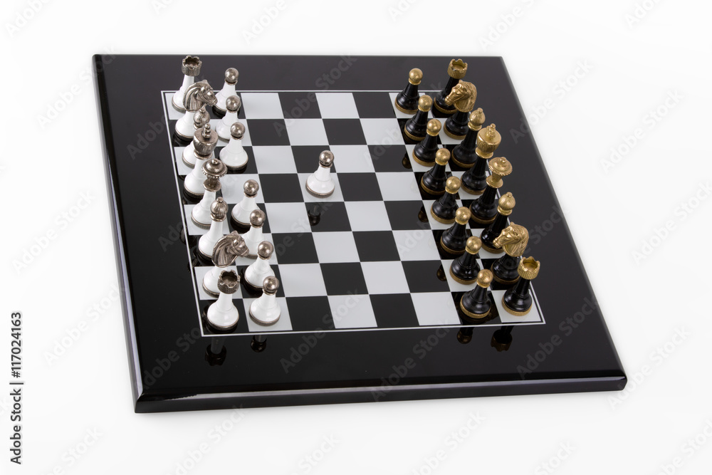 Black board on a white background. Classic black and white pieces with metal heads Black board on a white background. Classic black and white pieces with metal heads