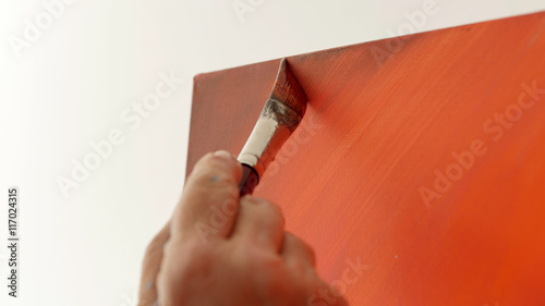 An artist is showing some techniques of painting