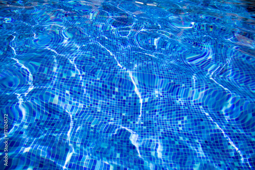 reflection  blue  water  of swimming pool with mosaic bottom