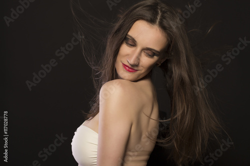 Woman with hair motion at the studio