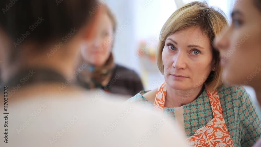 Group of women discuss with each other theme of seminar Group of women discuss with each other theme of seminar