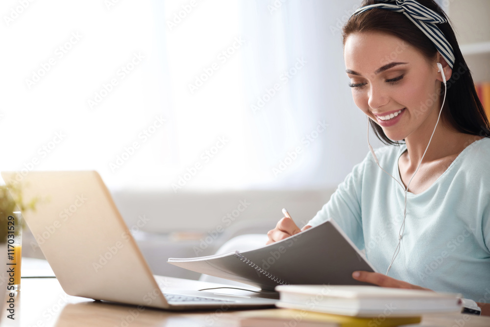 Cheerful woman sitting at the table Cheerful woman sitting at the table