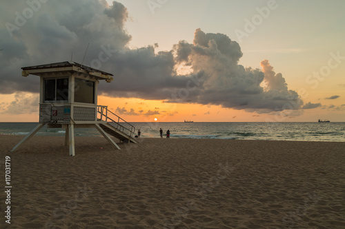 Lifeguard tower/ People on the beach enjoying beautiful sunrise. © Satoshi Kina