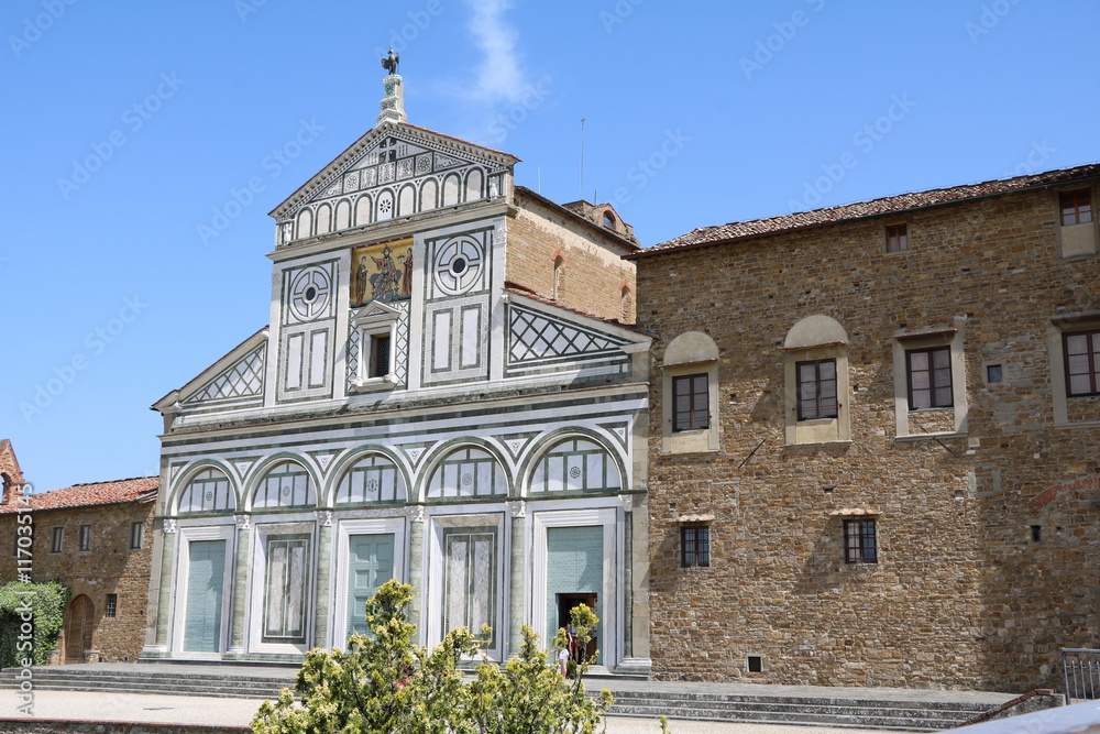 Basilica San Miniato al Monte under blue sky in Florence, Italy