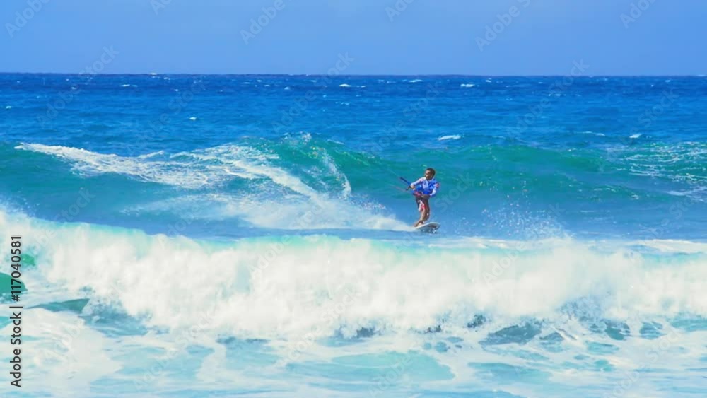 Amazing skills and tricks of active man surfing in ocean on kitesurf board Amazing skills and tricks of active man surfing in ocean on kitesurf board
