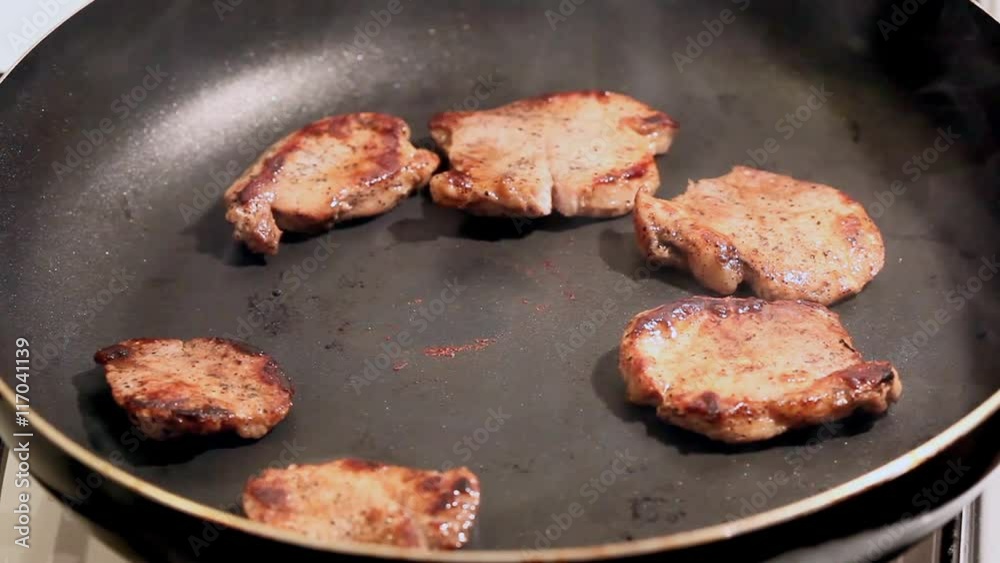 fry the meat in a frying pan, Chef preparing and spicing meat restaurant kitchen fry the meat in a frying pan, Chef preparing and spicing meat restaurant kitchen