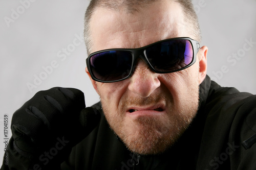 angry man in dark glasses