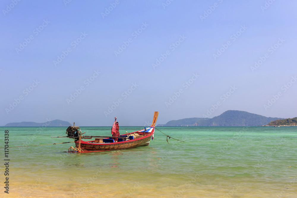 long tail boat at sea in phuket Thailand and sky blue