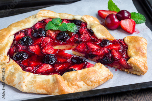 Konstfotografi Cottage cheese dough galette with strawberry and cherry, horizontal