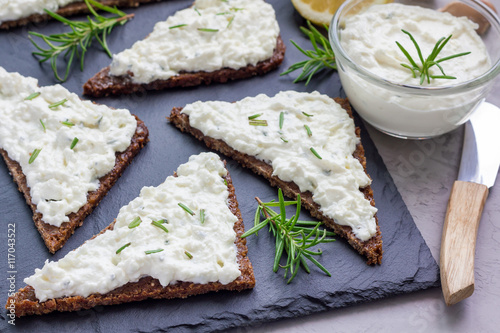 Pumpernickel bread with feta, cream cheese, rosemary, lemon, garlic dip