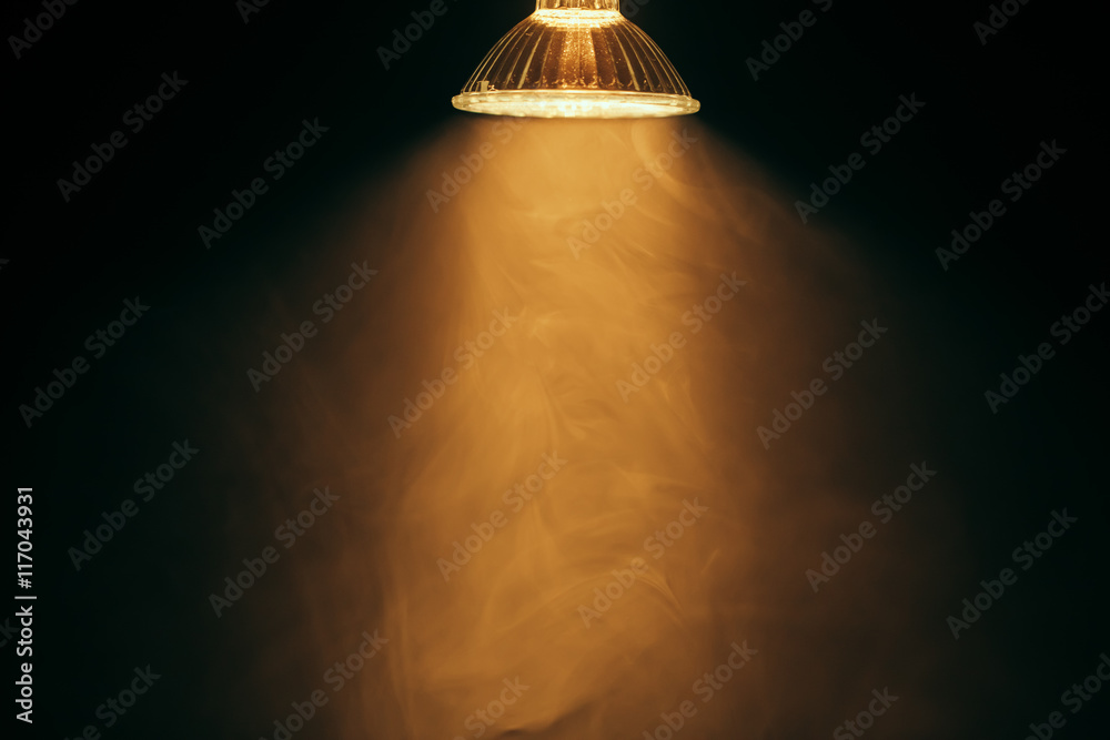 halogen lamp with reflector, warm light in fog - obrazy, fototapety, plakaty 