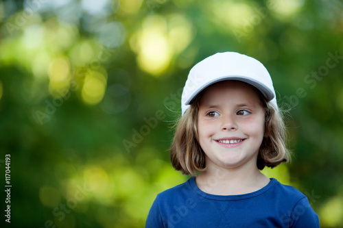 Little cute girl with a cap in the park © Gelpi