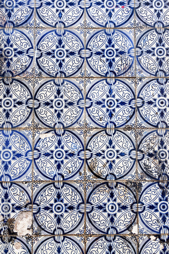 Close up image of decorated tiles on houses in streets