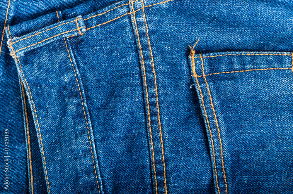 Closeup photo of denim jeans showing texture and stitching. Closeup photo of denim jeans showing texture and stitching.