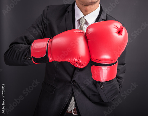 Young businessman with boxing gloves © sorapop