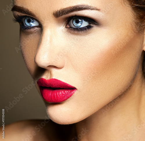 sensual glamour portrait of beautiful woman model lady with fresh daily makeup with red lips color and clean healthy skin face