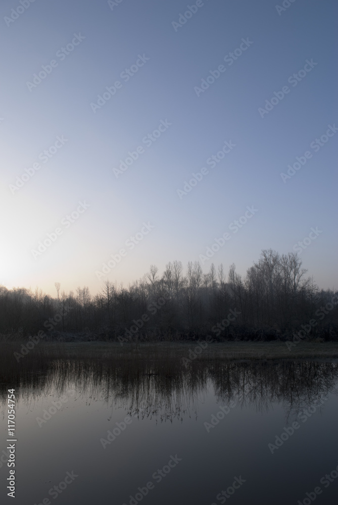 Sunrise over frozen landscape.