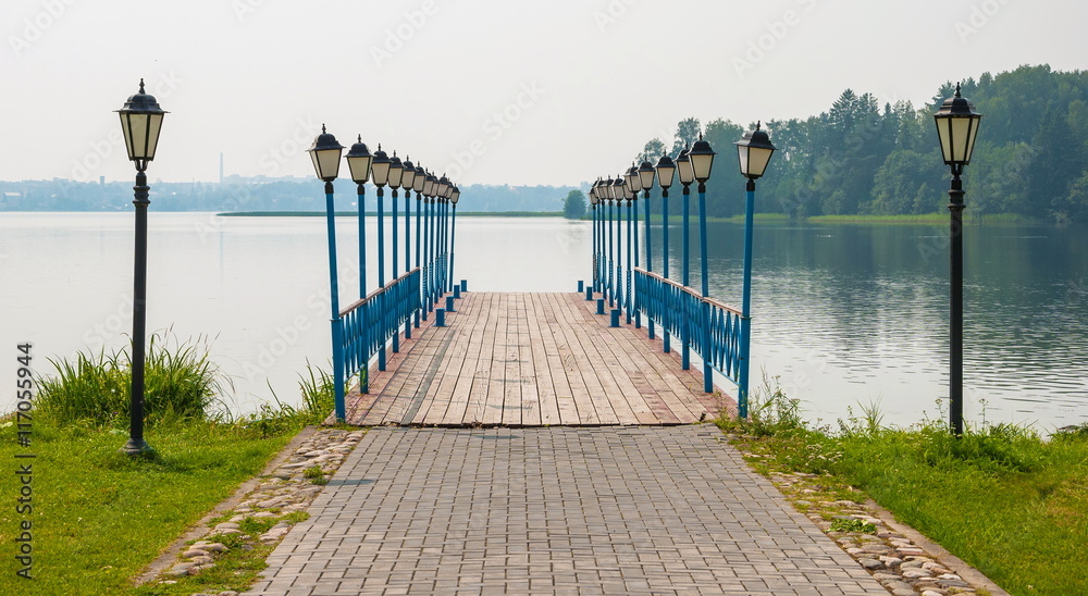 Pier on the lake is decorated with lanterns