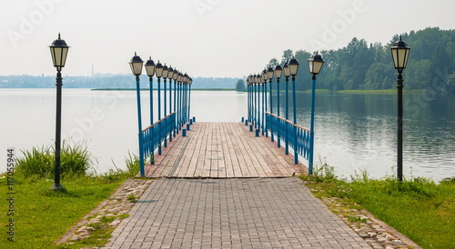 Pier on the lake is decorated with lanterns