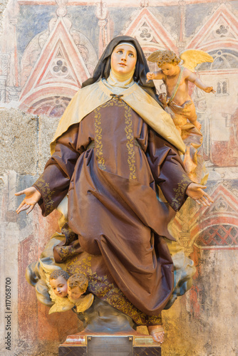 AVILA, SPAIN, APRIL - 18, 2016: The polychrome carved statue of St. Theresia of Avila in Catedral de Cristo Salvador by unknown artist from year 1964.