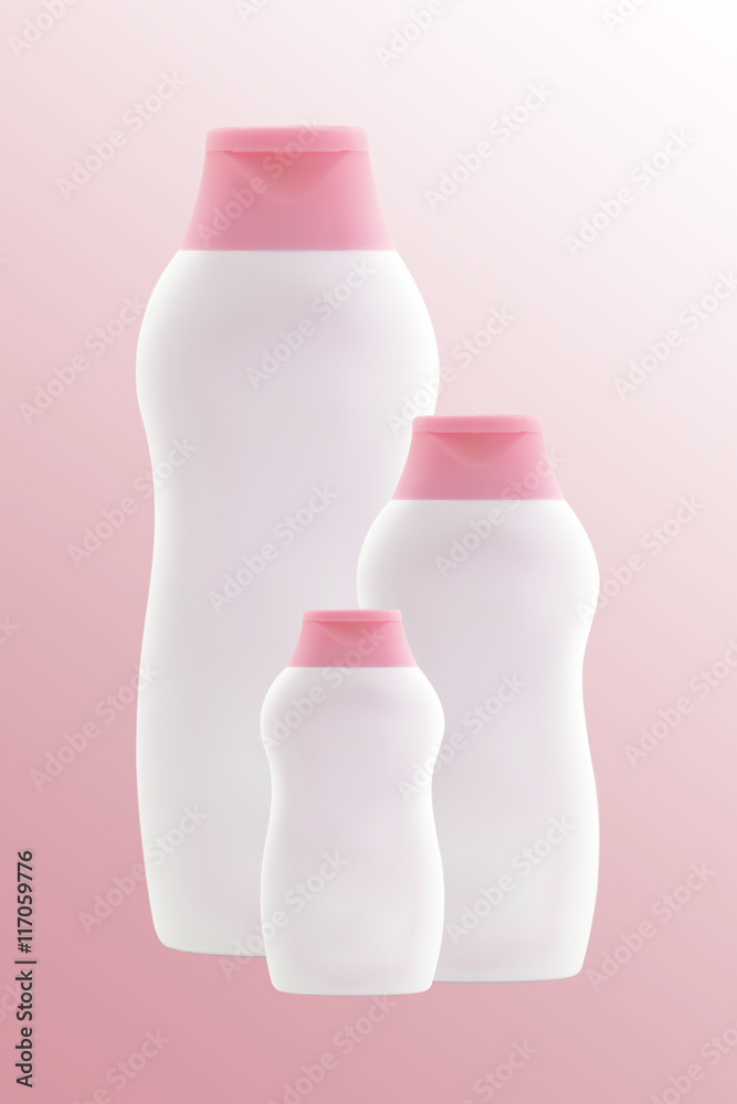 Three empty light pink bottles. Isolated Three empty light pink bottles. Isolated