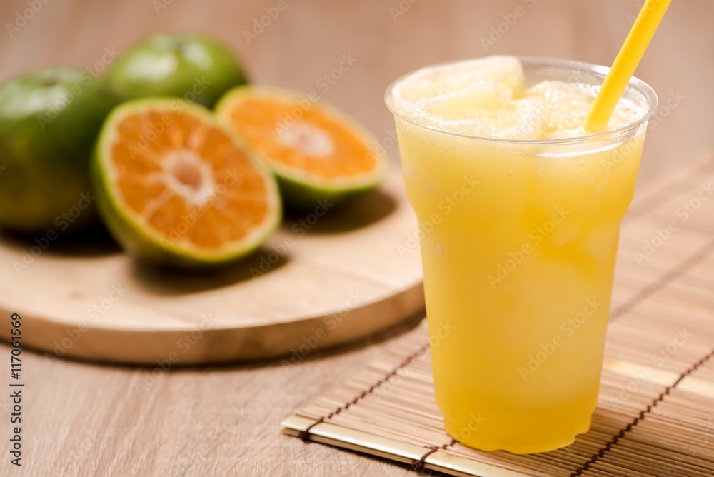 Orange Juice in glass on wood table Orange Juice in glass on wood table