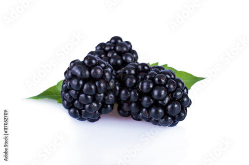 Fresh blackberries with leaves isolated on white background