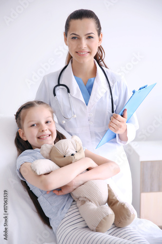 Cute girl visiting doctor