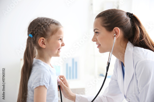 Cute girl visiting doctor
