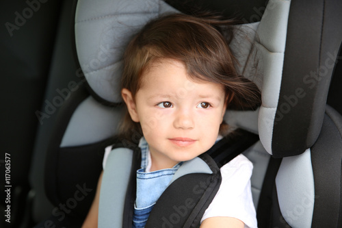 Boy sitting in a car in saf...
