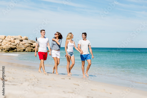 Company of young people on the beach