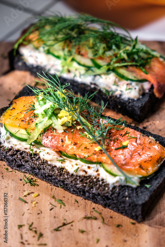 Charcoal Bread Smoked Salmon Sandwiches on wood board