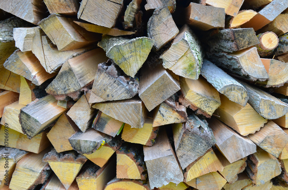 Natural wooden background - closeup of chopped firewood